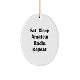 Gifts from Family, Friends, or Coworkers - 'Eat. Sleep. Amateur Radio. Repeat.' Oval Ornament, White, Christmas Unique Gifts for Amateur Radio Enthusiasts - Image 1